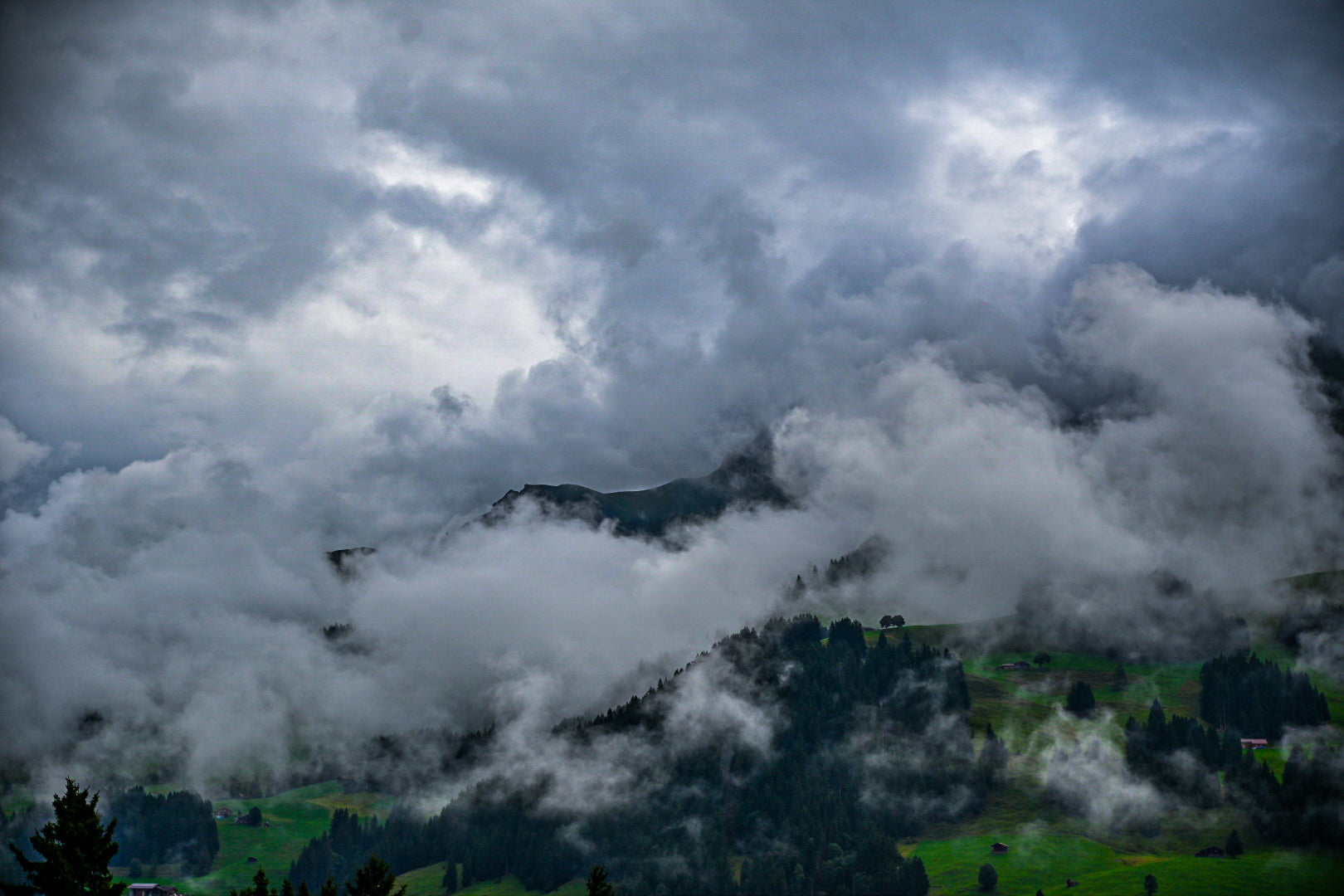 Mountain landscape with clouds rolling over the peaks